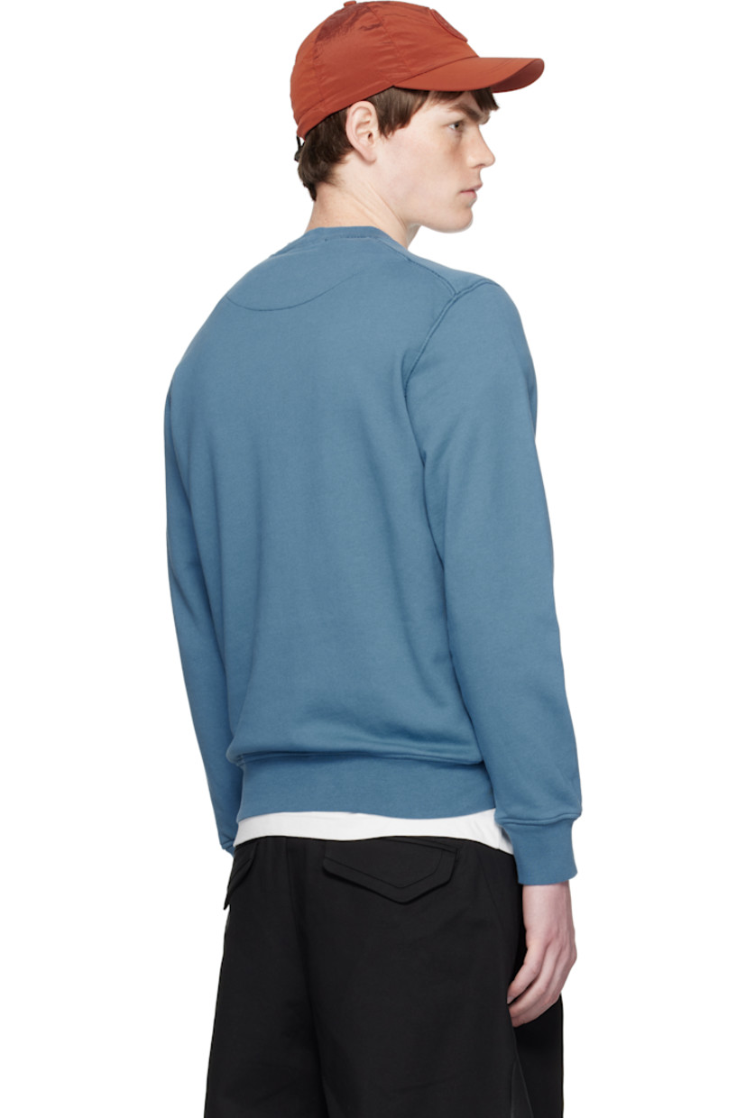Organic cotton French terry sweatshirt.

· Garment-dyed
· Rib-knit crewneck, hem, and cuffs
· Detachable logo patch at sleeve

Supplier color: Blue acciaio