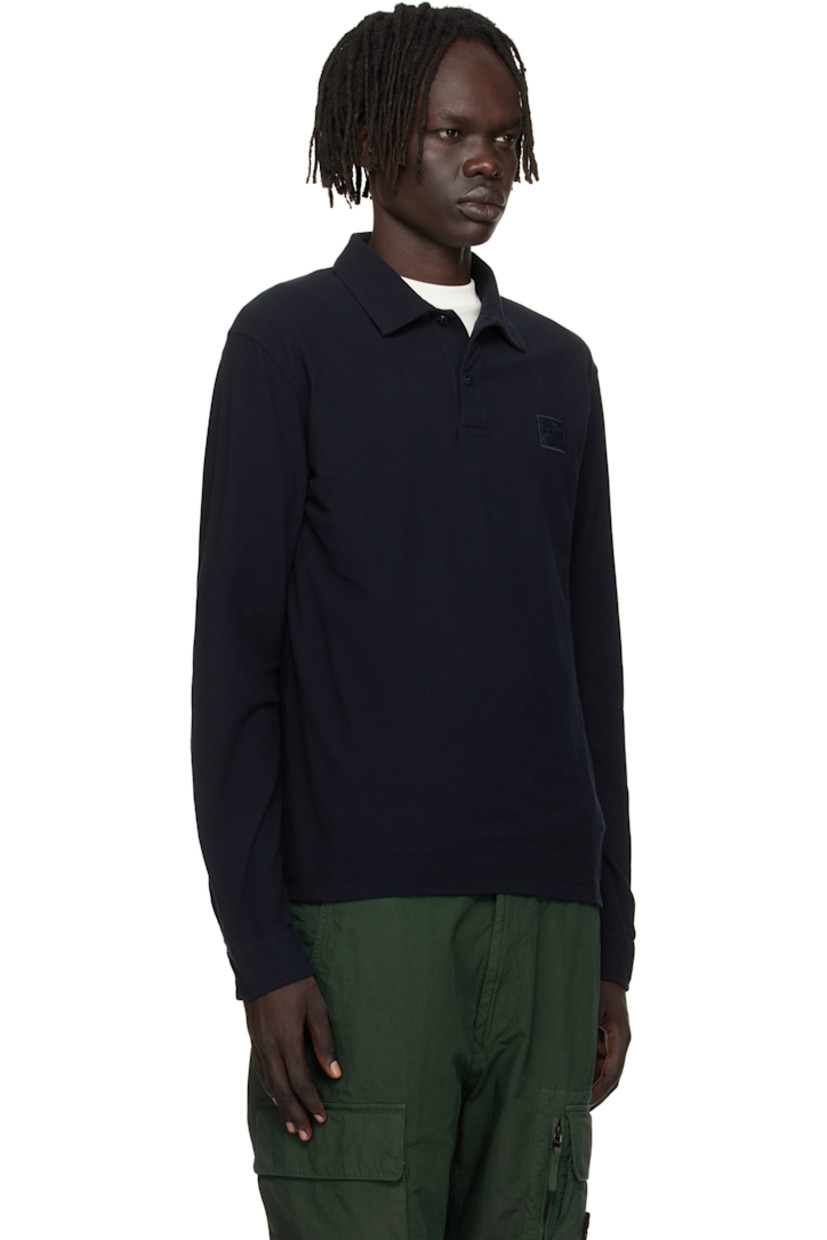 Cotton jersey polo.

· Garment-dyed
· Spread collar 
· Two-button placket 
· Embroidered logo patch at chest
· Buttoned barrel cuffs

Part of the Ghost collection.

Supplier color: Navy blue