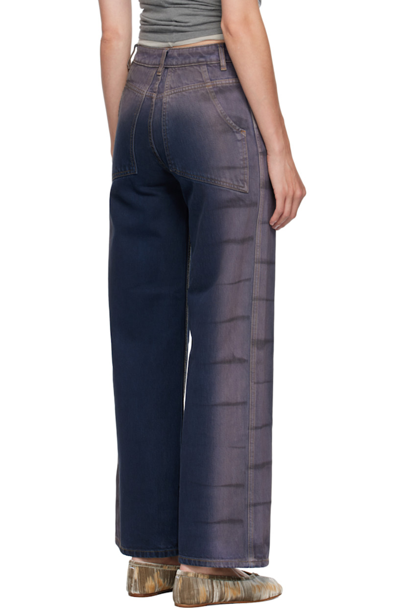 14 oz non-stretch denim jeans. 

· Overdyed and bleached
· Wide-leg 
· Belt loops
· Four-pocket styling
· Zip fly
· Stripes at outseams 
· Contrast stitching in tan 

Supplier color: Wrinkle