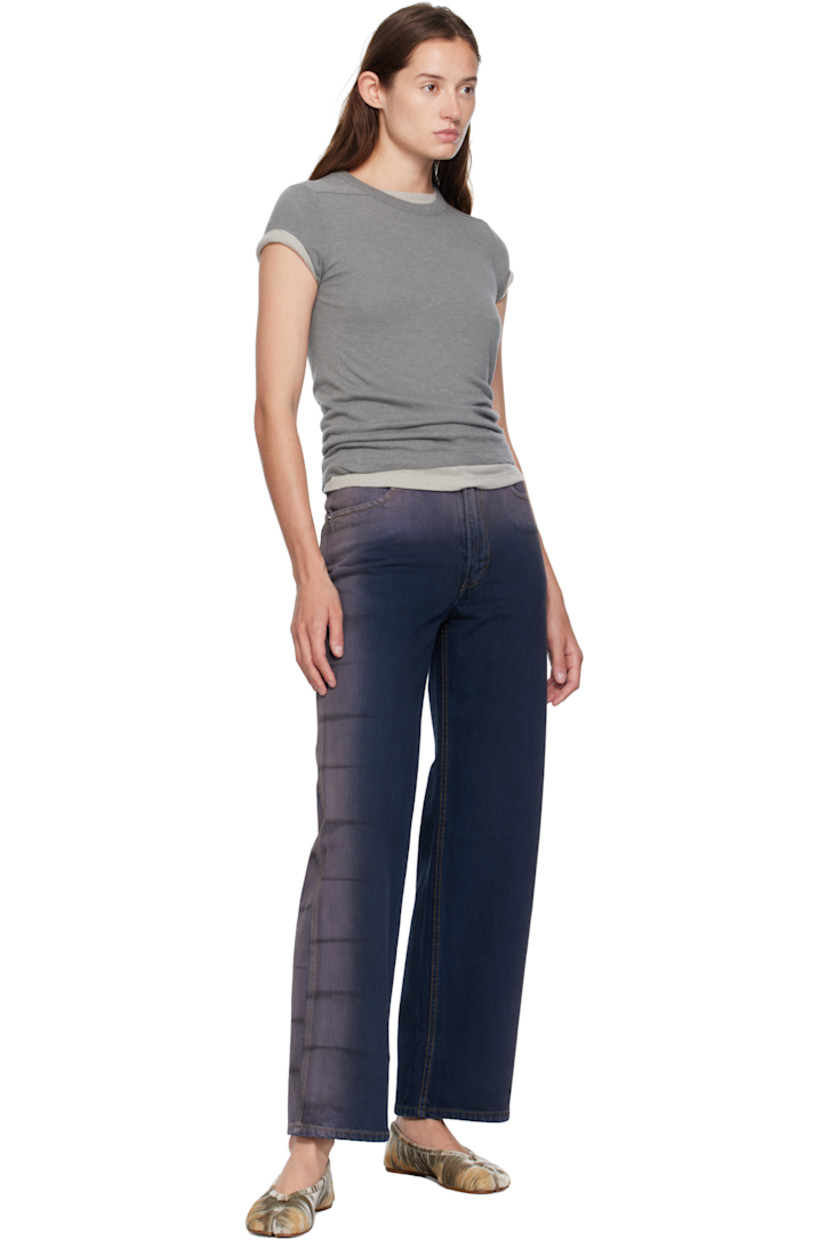 14 oz non-stretch denim jeans. 

· Overdyed and bleached
· Wide-leg 
· Belt loops
· Four-pocket styling
· Zip fly
· Stripes at outseams 
· Contrast stitching in tan 

Supplier color: Wrinkle