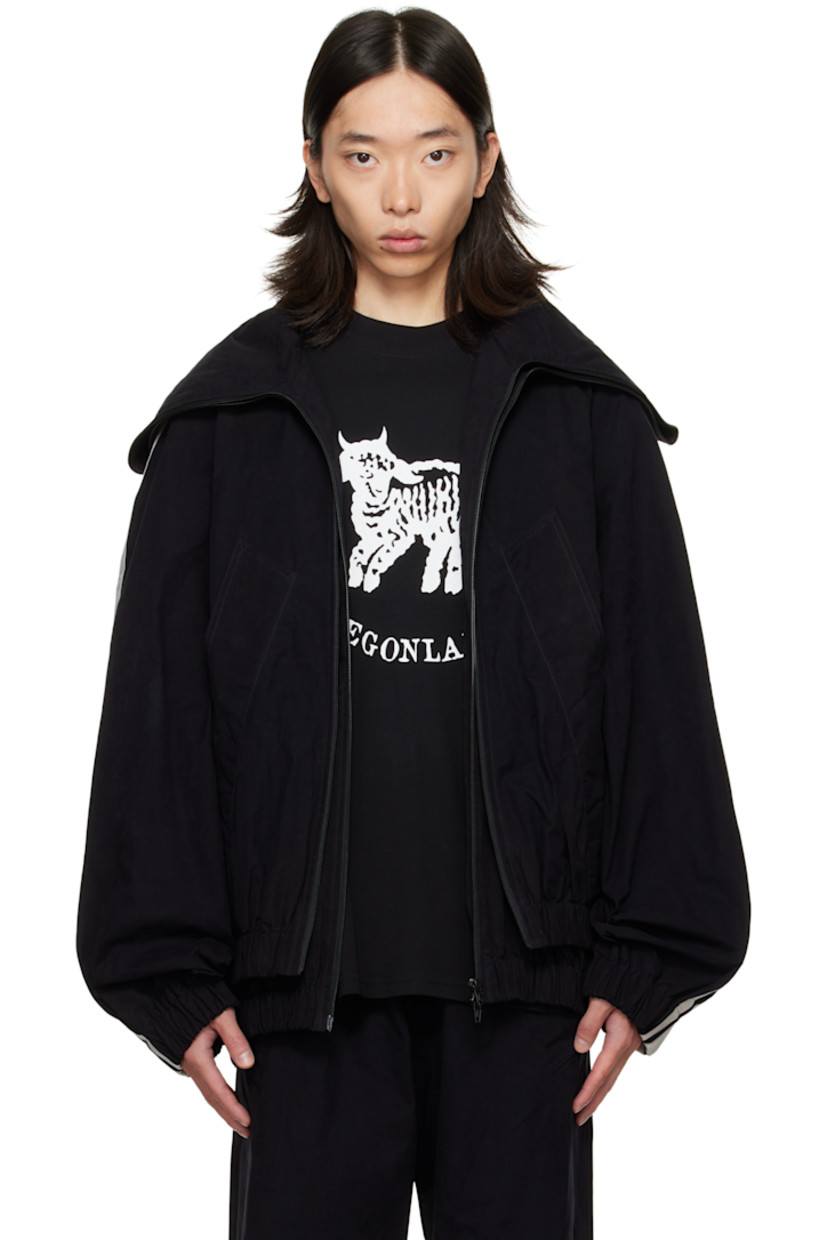 Cotton-blend broadcloth track jacket. 

· Layered construction 
· Modified stand collar 
· Two-way zip closure 
· Welt pockets at front 
· Elasticized hem and cuffs
· Stripe appliqué at raglan sleeves
· Full satin lining 

Supplier color: Black