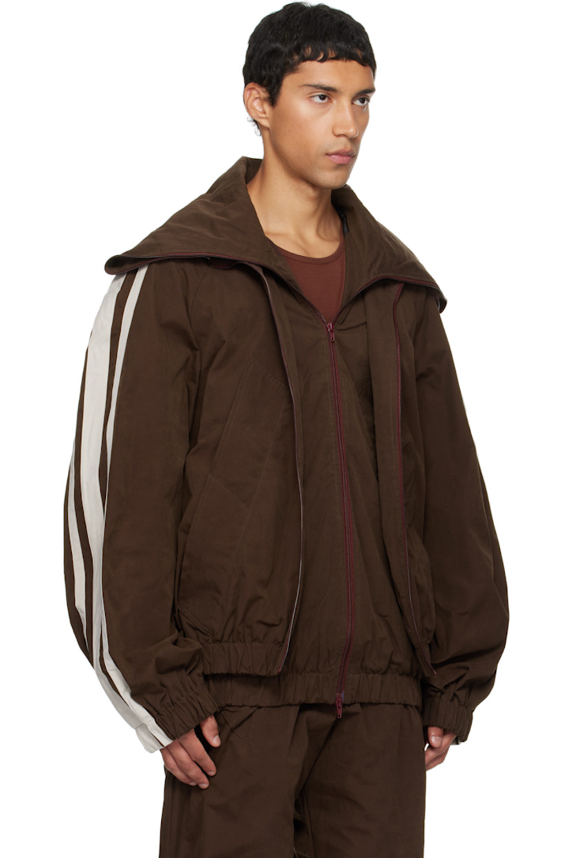 Cotton-blend canvas jacket. 

· Layered construction 
· Modified stand collar 
· Two-way zip closure 
· Welt pockets at front 
· Elasticized hem and cuffs
· Striped raglan sleeves
· Full logo-woven satin lining 

Supplier color: Brown