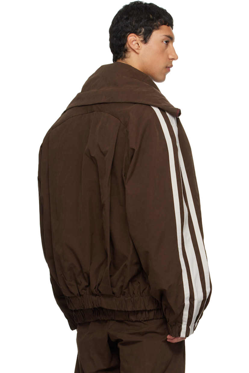 Cotton-blend canvas jacket. 

· Layered construction 
· Modified stand collar 
· Two-way zip closure 
· Welt pockets at front 
· Elasticized hem and cuffs
· Striped raglan sleeves
· Full logo-woven satin lining 

Supplier color: Brown