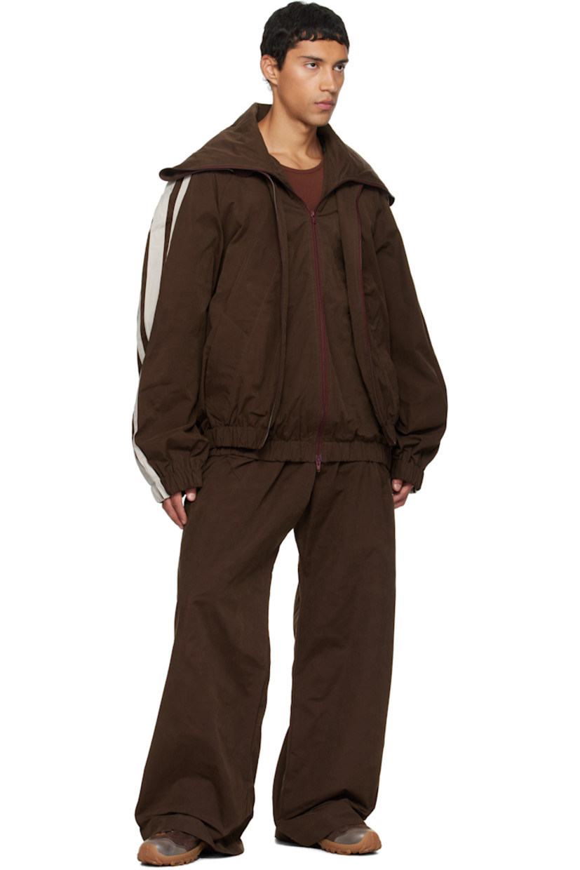 Cotton-blend canvas jacket. 

· Layered construction 
· Modified stand collar 
· Two-way zip closure 
· Welt pockets at front 
· Elasticized hem and cuffs
· Striped raglan sleeves
· Full logo-woven satin lining 

Supplier color: Brown