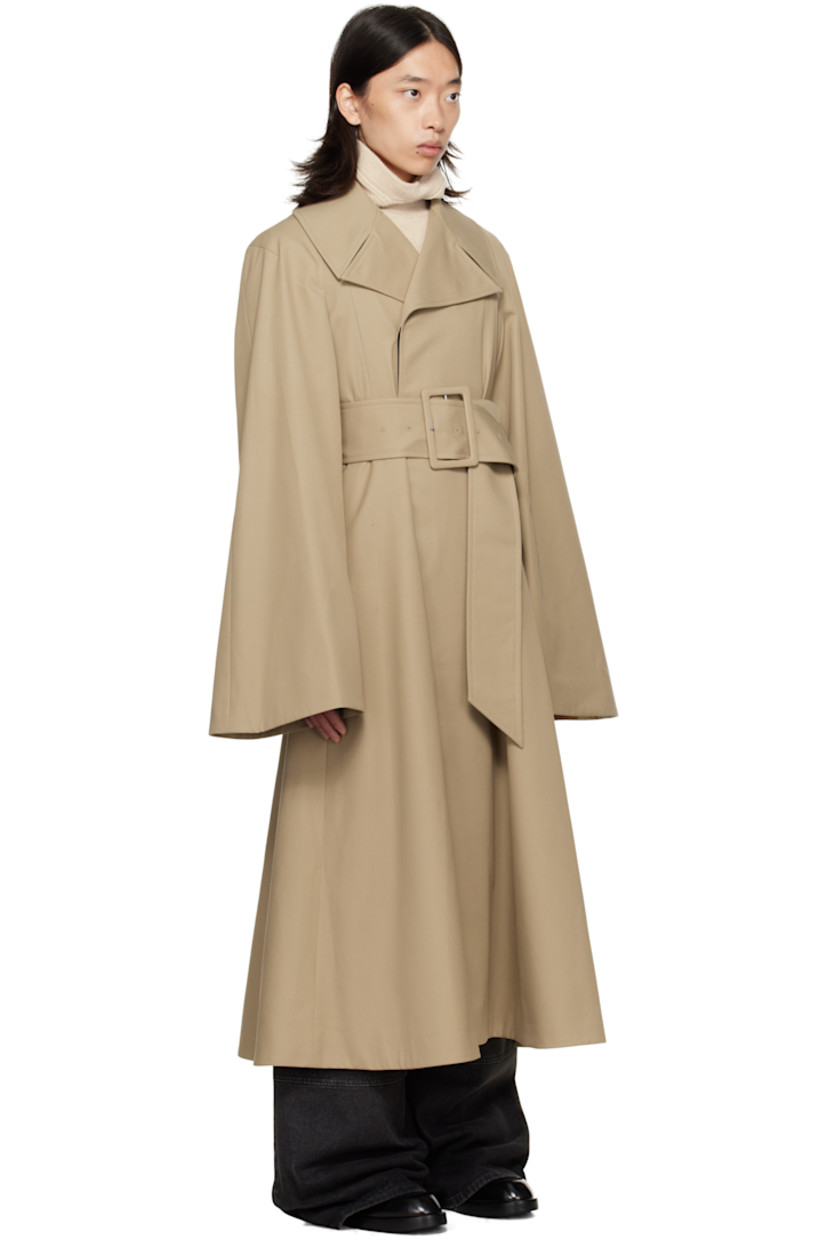 Cotton-blend gabardine trench coat.

· Notched lapel
· Concealed button closure
· Belt loops and detachable pin-buckle belt at waist
· Seam pockets
· Raglan sleeves
· Full satin lining

Supplier color: Beige