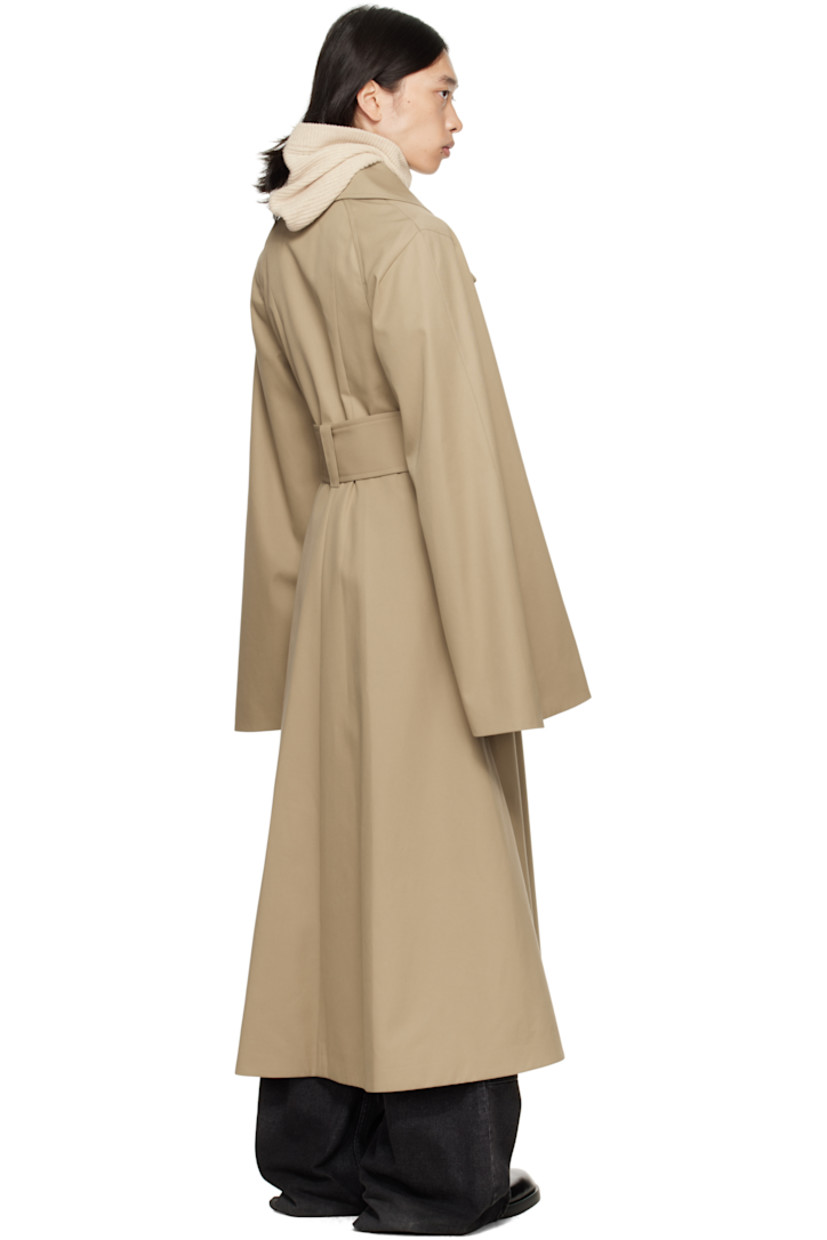 Cotton-blend gabardine trench coat.

· Notched lapel
· Concealed button closure
· Belt loops and detachable pin-buckle belt at waist
· Seam pockets
· Raglan sleeves
· Full satin lining

Supplier color: Beige