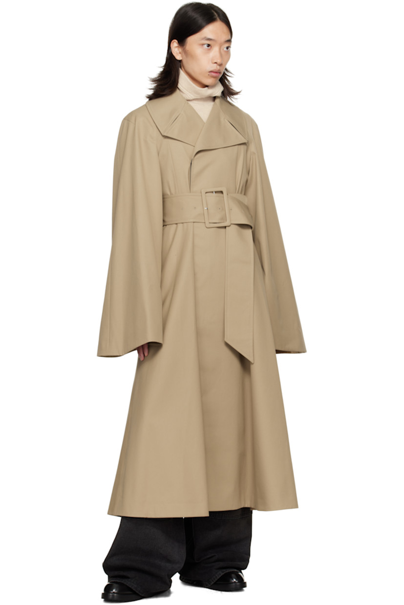 Cotton-blend gabardine trench coat.

· Notched lapel
· Concealed button closure
· Belt loops and detachable pin-buckle belt at waist
· Seam pockets
· Raglan sleeves
· Full satin lining

Supplier color: Beige