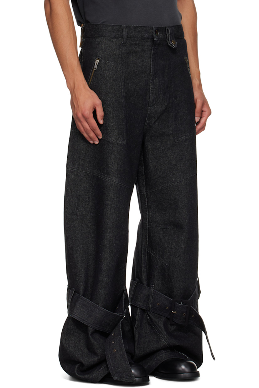 Non-stretch denim jeans.

· Belt loops
· Press-stud belt loop
· Four-pocket styling
· Zip fly
· Darts at knees
· Pin-buckle strap at legs
· Logo patch at back waistband

Supplier color: Black