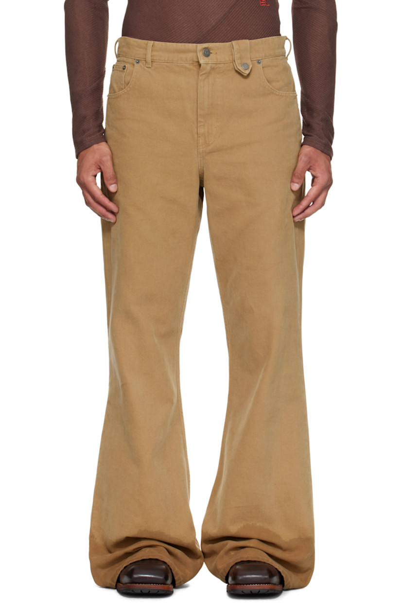 Cotton canvas jeans. 

· Wide-leg 
· Belt loops
· Press-stud tab at waistband 
· Five-pocket styling
· Zip fly 
· Discoloration at cuffs
· Logo patch at back waistband

Supplier color: Beige
