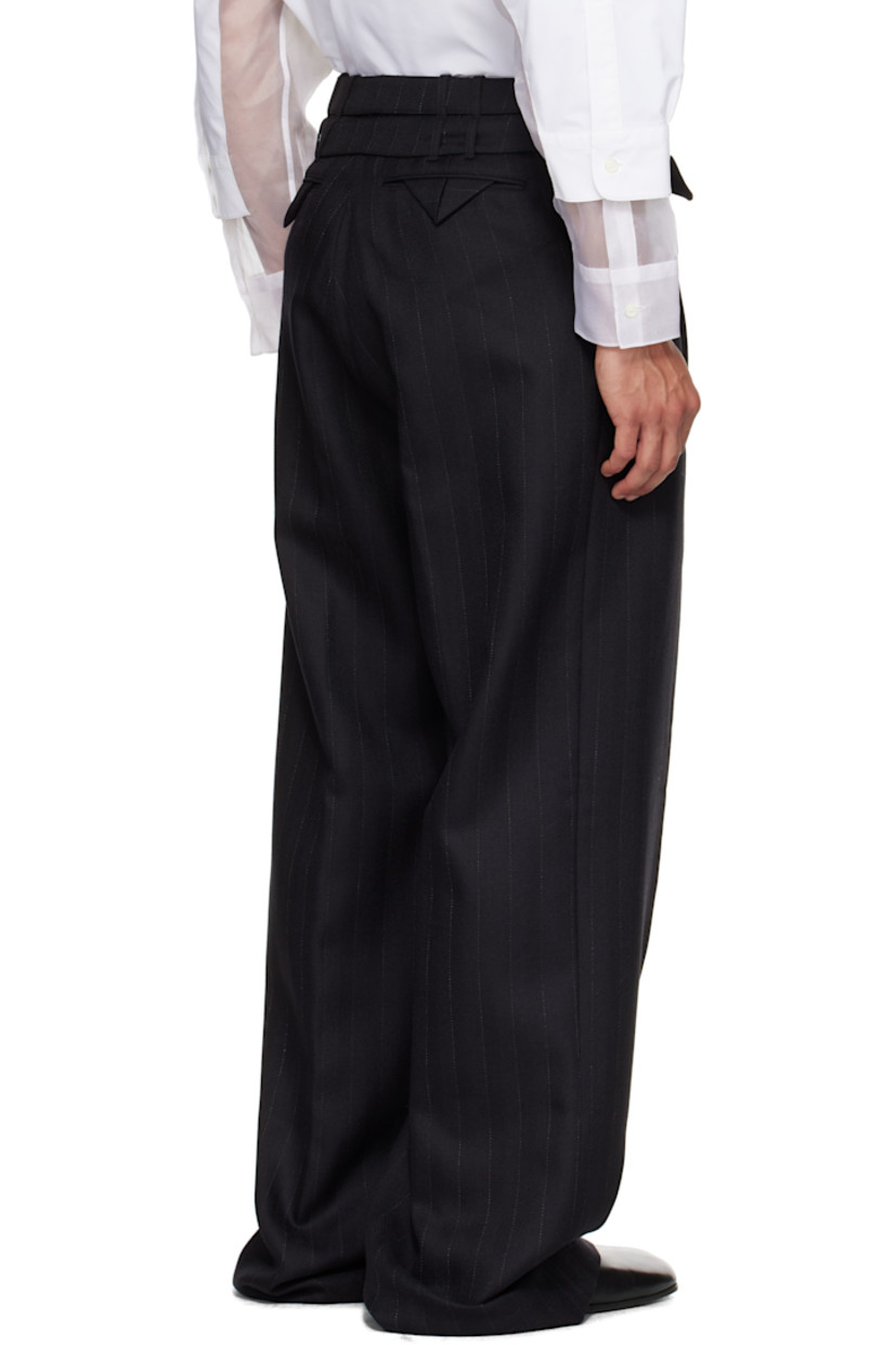 Virgin wool herringbone trousers.

· Pinstripes throughout
· High-rise
· Belt loops and detachable pin-buckle belts at waistband
· Four-pocket styling
· Zip fly
· Pleats at front

Supplier color: Black