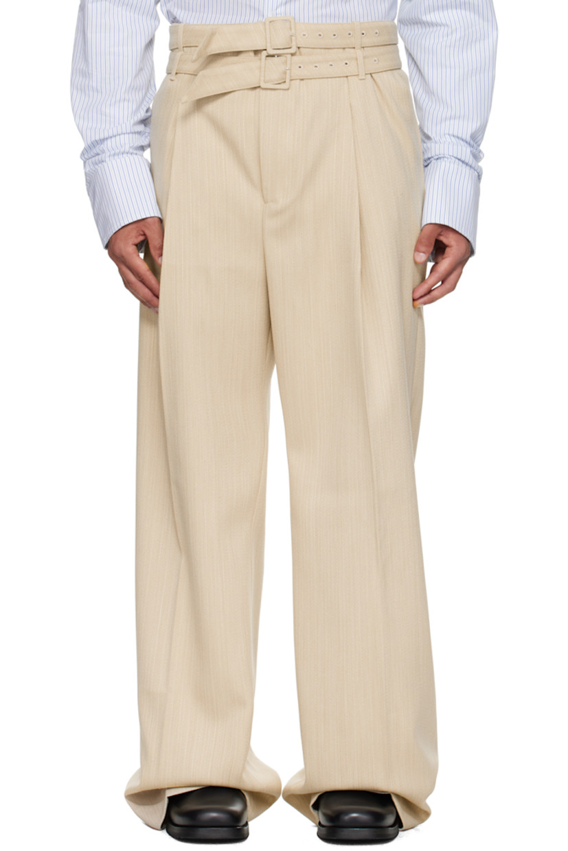 Virgin wool tweed trousers.

· High-rise 
· Layered belt loops and detachable pin-buckle belt 
· Four-pocket styling
· Zip fly 
· Pleats at front 
· Creased legs

Supplier color: Beige