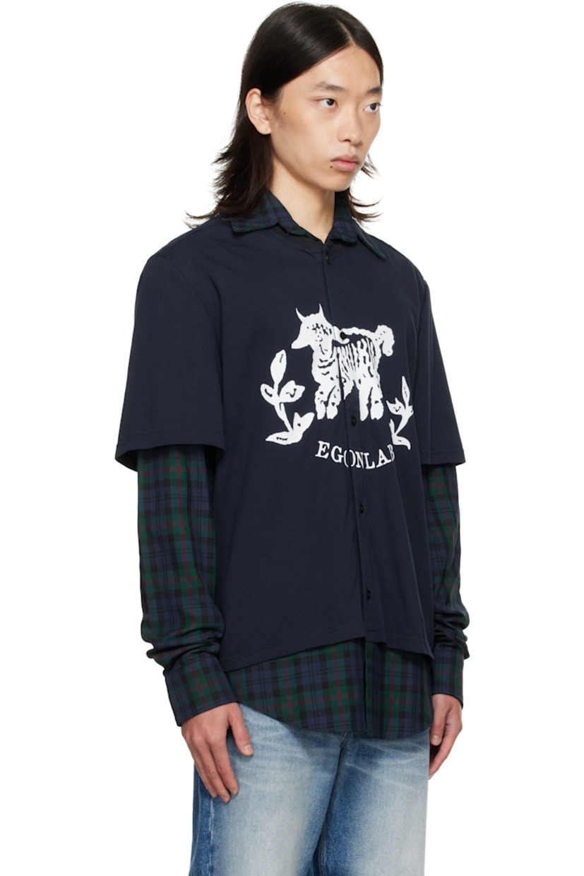 Cotton-blend flannel and cotton jersey shirt.

· Check pattern throughout
· Layered construction
· Spread collar
· Button closure
· Graphic and logo printed at front
· Shirttail hem
· Buttoned barrel cuffs

Supplier color: Tartan