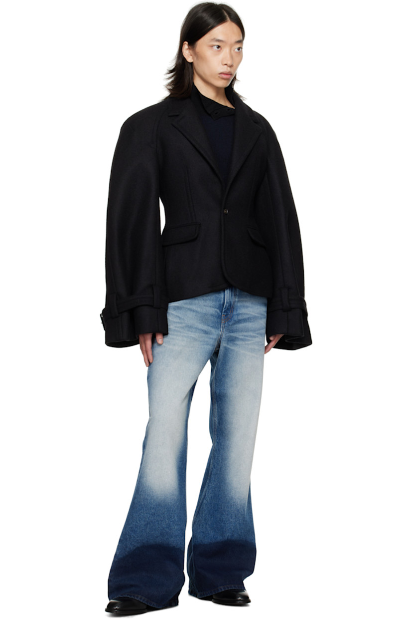 Wool-blend melton blazer.

· Notched lapel
· Button closure
· Flap pockets at front
· Raglan sleeves
· Pin-buckle strap at cuffs
· Central vent at back hem
· Welt pockets at interior
· Full satin lining

Supplier color: Black