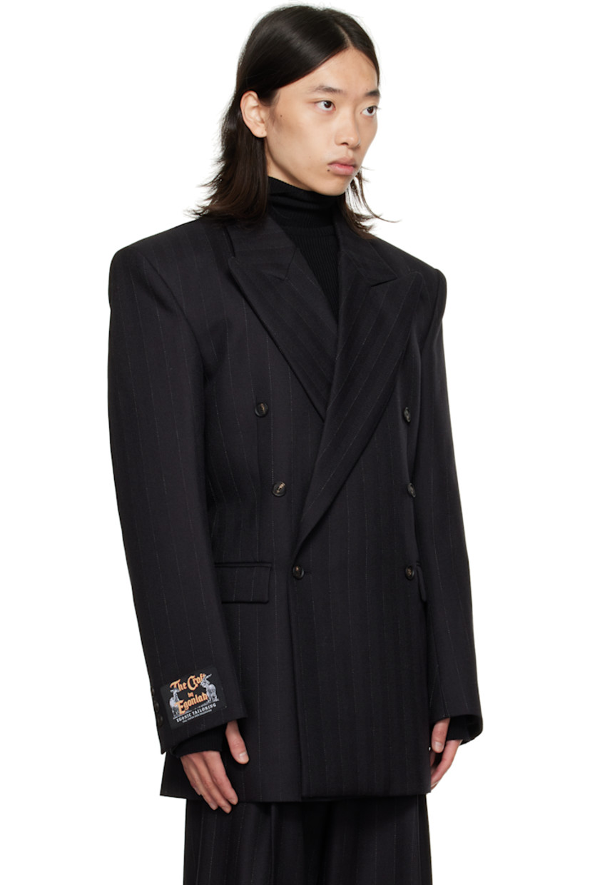 Virgin wool herringbone blazer.

· Peaked lapel
· Double-breasted button closure
· Flap pockets at front
· Padded shoulders
· Logo patch at cuff
· Surgeon's cuffs
· Button strap at back
· Central vent at back hem
· Welt pockets at interior
· Full satin lining

Supplier color: Black