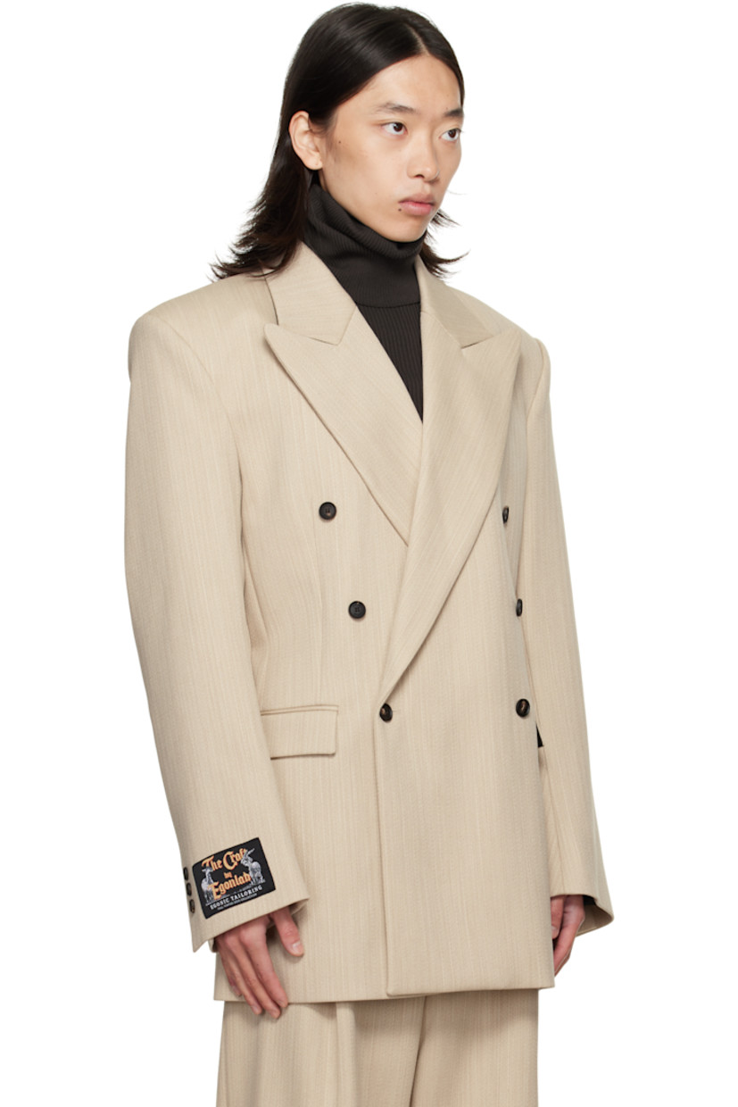 Virgin wool canvas blazer.

· Peaked lapel
· Double-breasted button closure
· Flap pockets at front
· Padded shoulders
· Logo patch at cuff
· Surgeon's cuffs
· Button strap at back
· Central vent at back hem
· Welt pockets at interior
· Full satin lining

Supplier color: Beige