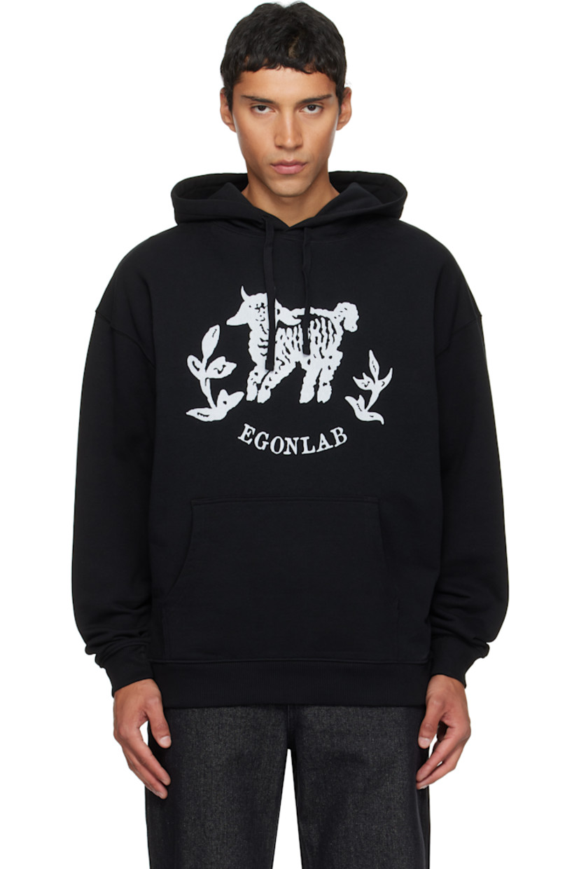 Organic cotton fleece hoodie.

· Drawstring at hood
· Graphic and logo printed at chest
· Kangaroo pocket
· Rib-knit hem and cuffs
· Dropped shoulders
· Text and logo graphic printed at back

Supplier color: Black