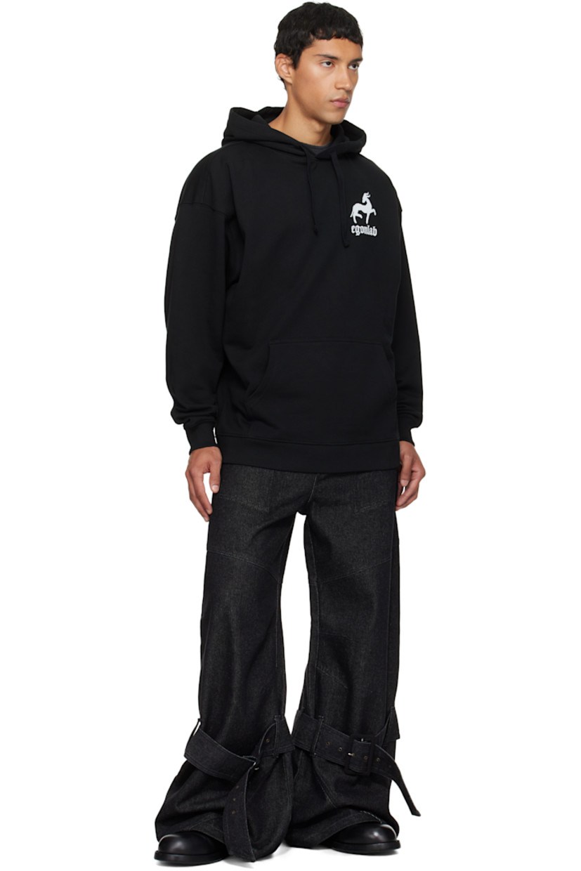 Organic cotton fleece hoodie.

· Drawstring at hood
· Graphic and logo printed at chest
· Kangaroo pocket
· Rib-knit hem and cuffs
· Dropped shoulders
· Text and logo graphic printed at back

Supplier color: Black
