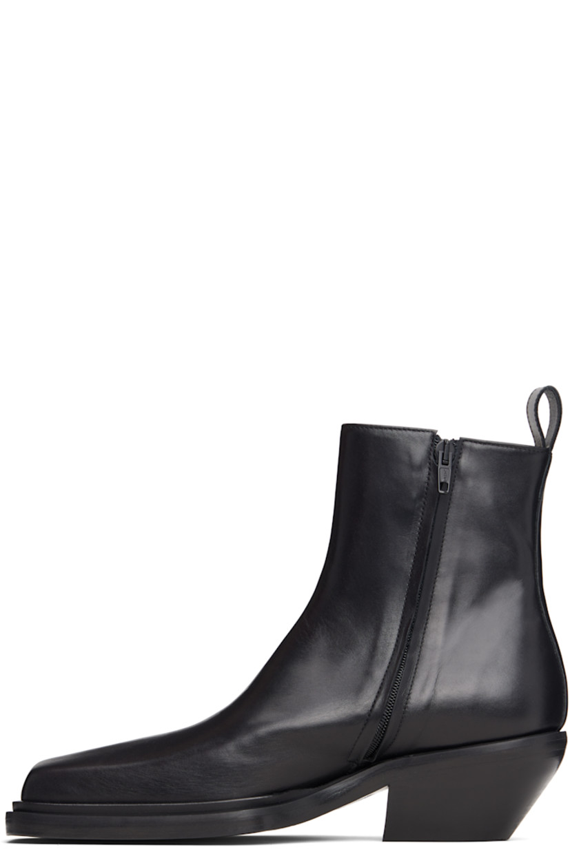 Ankle-high buffed leather boots.

· Square toe
· Zip closure at inner side
· Pull-loop at heel collar
· Stacked leather heel with rubber injection
· Leather sole
· Heel: H2.25"

Supplier color: Black