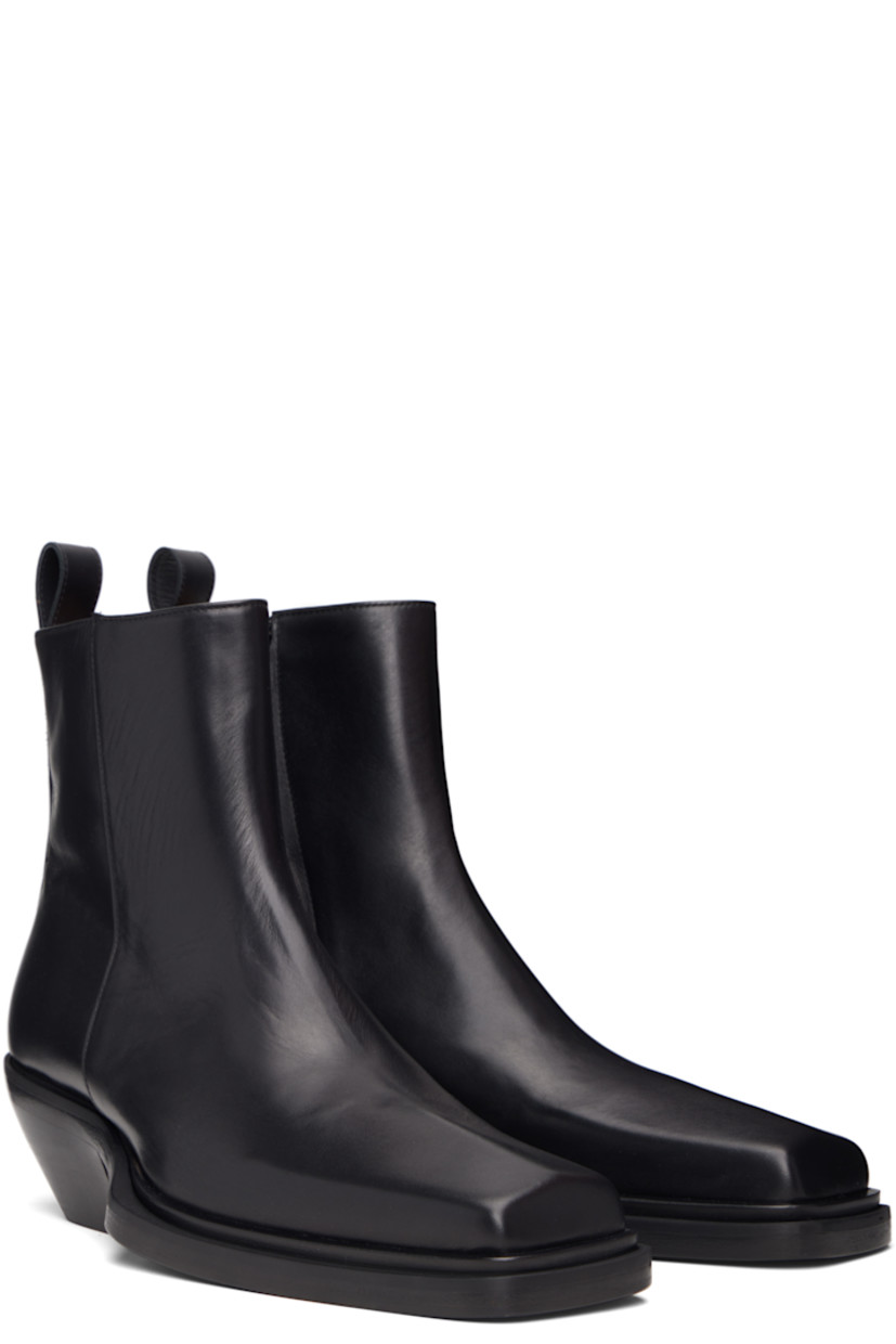 Ankle-high buffed leather boots.

· Square toe
· Zip closure at inner side
· Pull-loop at heel collar
· Stacked leather heel with rubber injection
· Leather sole
· Heel: H2.25"

Supplier color: Black