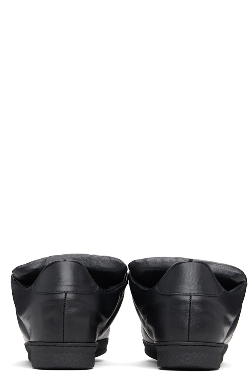 Low-top grained leather sneakers.

· Lace-up closure
· Padded tongue and collar
· Treaded rubber sole

Supplier color: Black