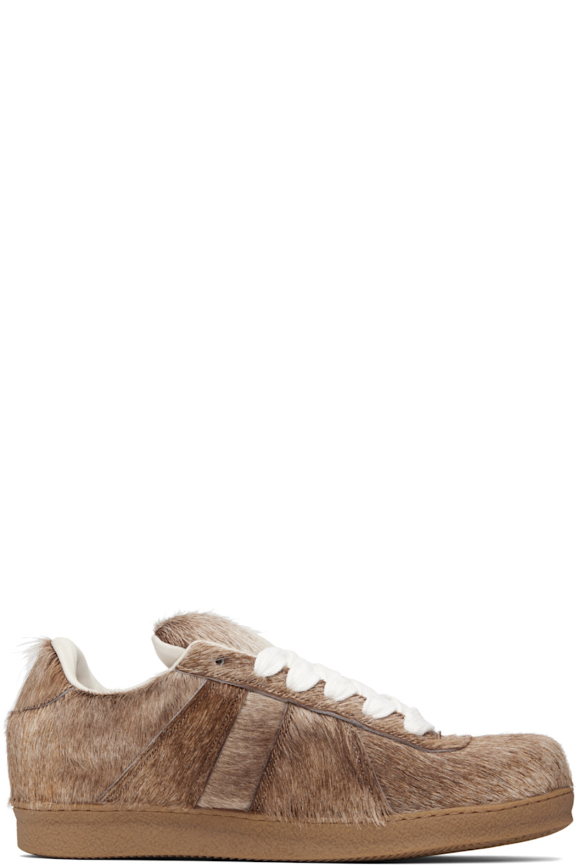 Low-top hair-on leather sneakers.

· Lace-up closure
· Padded tongue and collar
· Buffed leather lining
· Treaded rubber sole

Supplier color: Beige