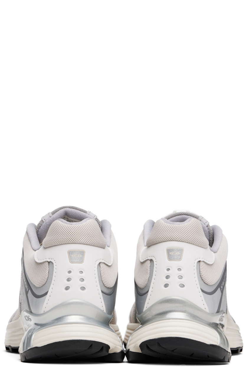 Low-top mesh and faux-nubuck sneakers in silver tone and beige.

· Reflective trim throughout
· Logo embossed at toe
· Quicklace™ closure
· Logo patch at padded tongue
· Padded collar
· sensiFIT™ panel at sides
· Logo printed at outer side and heel tab
· Molded OrthoLite® insole
· Mesh lining
· Agile Chassis™ System at EnergyCell midsole
· Treaded Mud Contagrip® rubber sole

Supplier color: Ftw silver/Lunar rock/Silver cloud