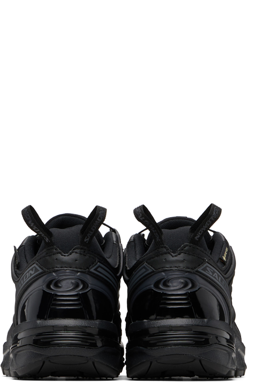 Low-top GORE-TEX™ faux-leather and anti-debris mesh sneakers.

· PFC-free waterproof
· Logos bonded throughout
· Quicklace® closure
· Logo patch at vamp
· Velcro tab and logo patch at padded tongue
· Padded collar
· sensiFIT™ panel at sides
· Logo flag at outer side
· Pull-loops at heel tab
· Logo embossed at heel counter
· Molded OrthoLite® footbed
· Mesh lining
· Agile Chassis™ System at foam rubber EnergyCell midsole
· Treaded All Terrain Contagrip® rubber sole

Supplier color: Black/Black/Asphalt