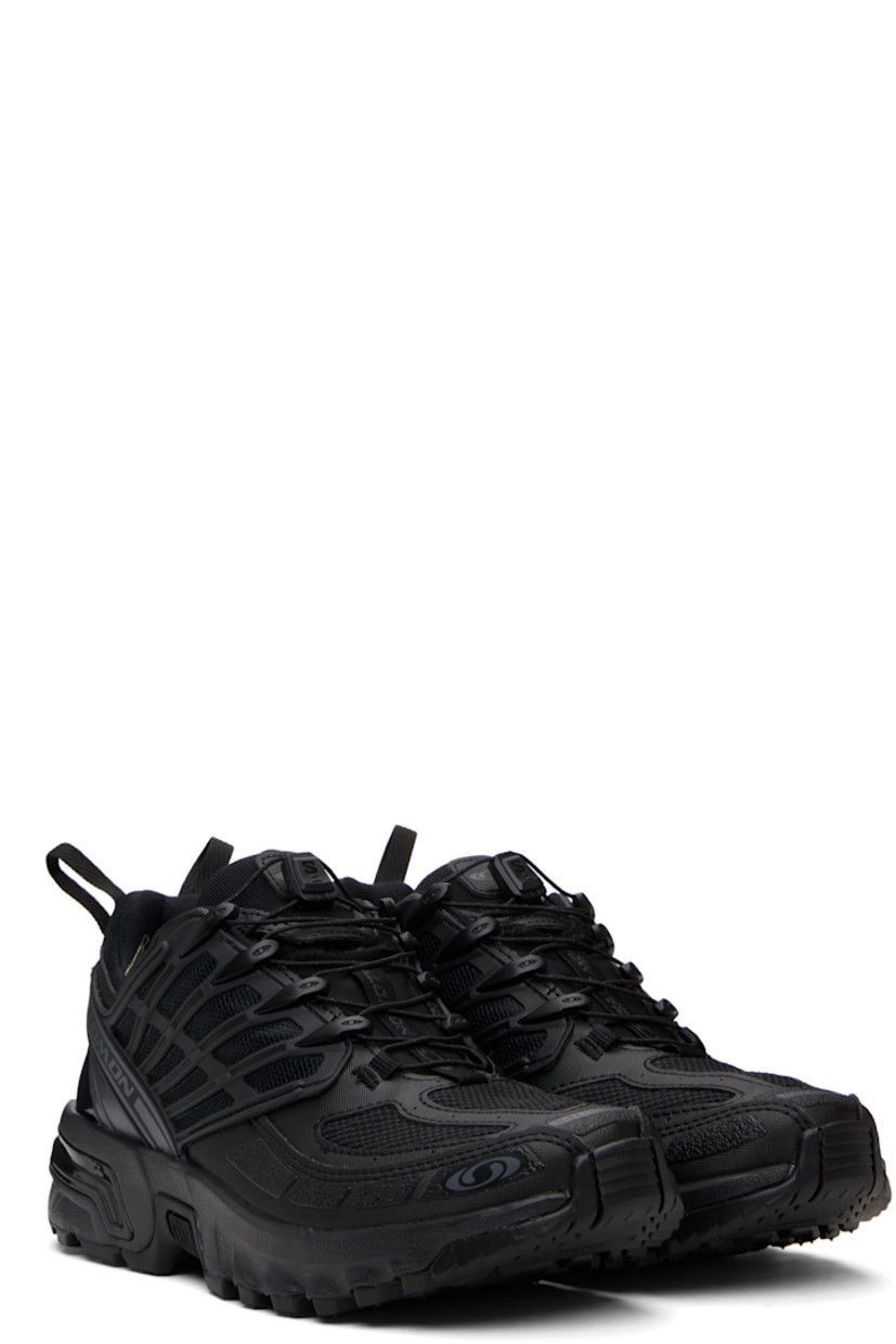 Low-top GORE-TEX™ faux-leather and anti-debris mesh sneakers.

· PFC-free waterproof
· Logos bonded throughout
· Quicklace® closure
· Logo patch at vamp
· Velcro tab and logo patch at padded tongue
· Padded collar
· sensiFIT™ panel at sides
· Logo flag at outer side
· Pull-loops at heel tab
· Logo embossed at heel counter
· Molded OrthoLite® footbed
· Mesh lining
· Agile Chassis™ System at foam rubber EnergyCell midsole
· Treaded All Terrain Contagrip® rubber sole

Supplier color: Black/Black/Asphalt