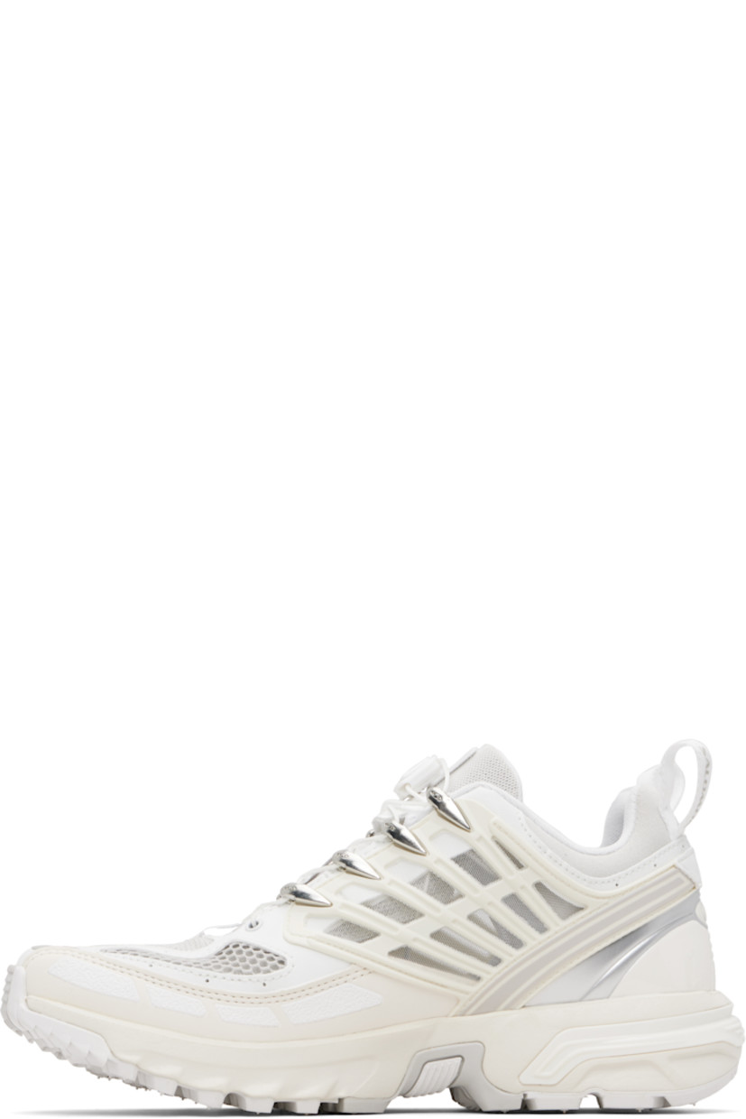 Low-top anti-debris 3D mesh and faux-leather sneakers.

· Logos bonded throughout
· Quicklace® closure
· Logo patch at vamp
· Velcro tab and logo patch at padded tongue
· Padded collar
· sensiFIT™ panel at sides
· Pull-loops at heel tab
· Logo embossed at heel counter
· Molded OrthoLite® footbed
· Mesh lining
· Agile Chassis™ System at foam rubber EnergyCell midsole
· Treaded All Terrain Contagrip® rubber sole

Supplier color: White/Vanilla ice/Lunar rock
