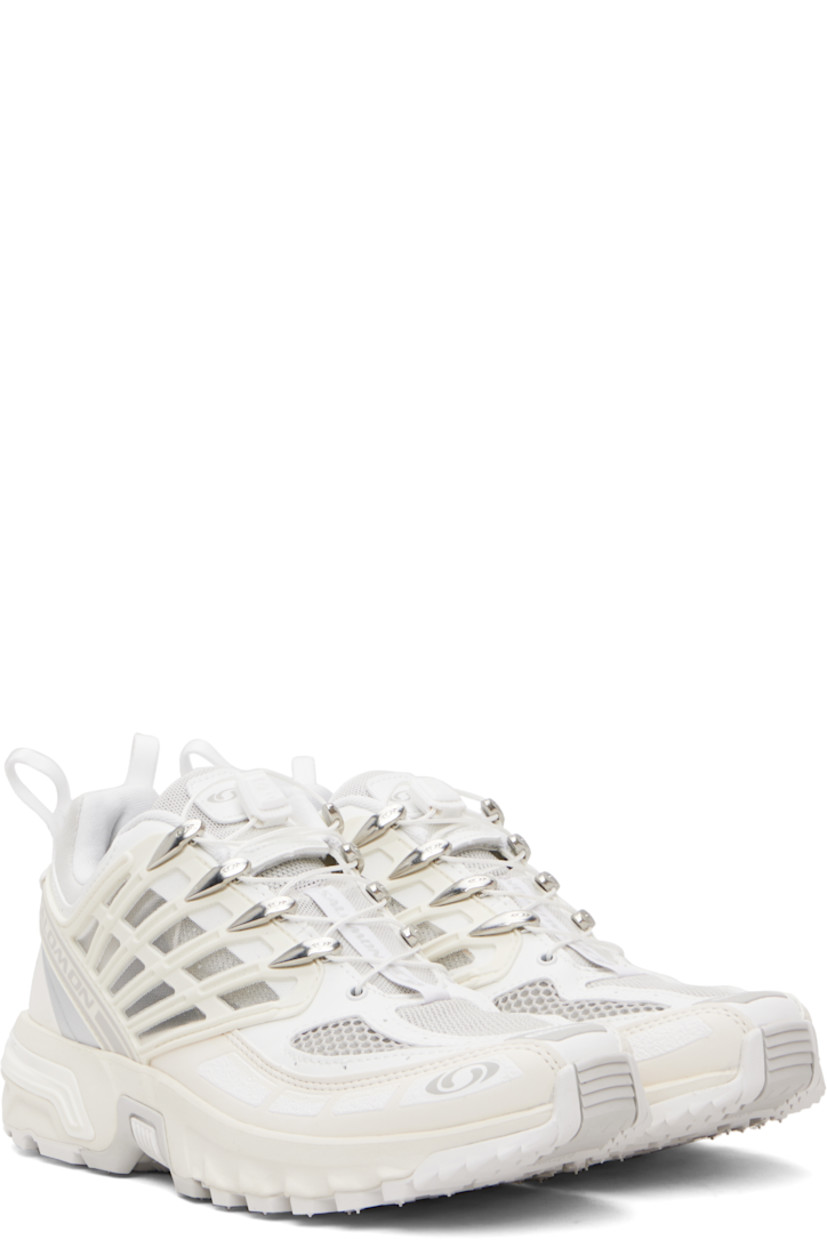 Low-top anti-debris 3D mesh and faux-leather sneakers.

· Logos bonded throughout
· Quicklace® closure
· Logo patch at vamp
· Velcro tab and logo patch at padded tongue
· Padded collar
· sensiFIT™ panel at sides
· Pull-loops at heel tab
· Logo embossed at heel counter
· Molded OrthoLite® footbed
· Mesh lining
· Agile Chassis™ System at foam rubber EnergyCell midsole
· Treaded All Terrain Contagrip® rubber sole

Supplier color: White/Vanilla ice/Lunar rock