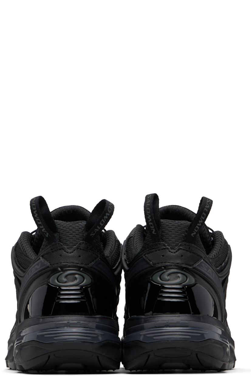Low-top anti-debris 3D mesh and faux-leather sneakers.

· Logos bonded throughout
· Quicklace® closure
· Logo patch at vamp
· Velcro tab and logo patch at padded tongue
· Padded collar
· sensiFIT™ panel at sides
· Pull-loops at heel tab
· Logo embossed at heel counter
· Molded OrthoLite® footbed
· Mesh lining
· Agile Chassis™ System at foam rubber EnergyCell midsole
· Treaded All Terrain Contagrip® rubber sole

Supplier color: Black/Black/Black