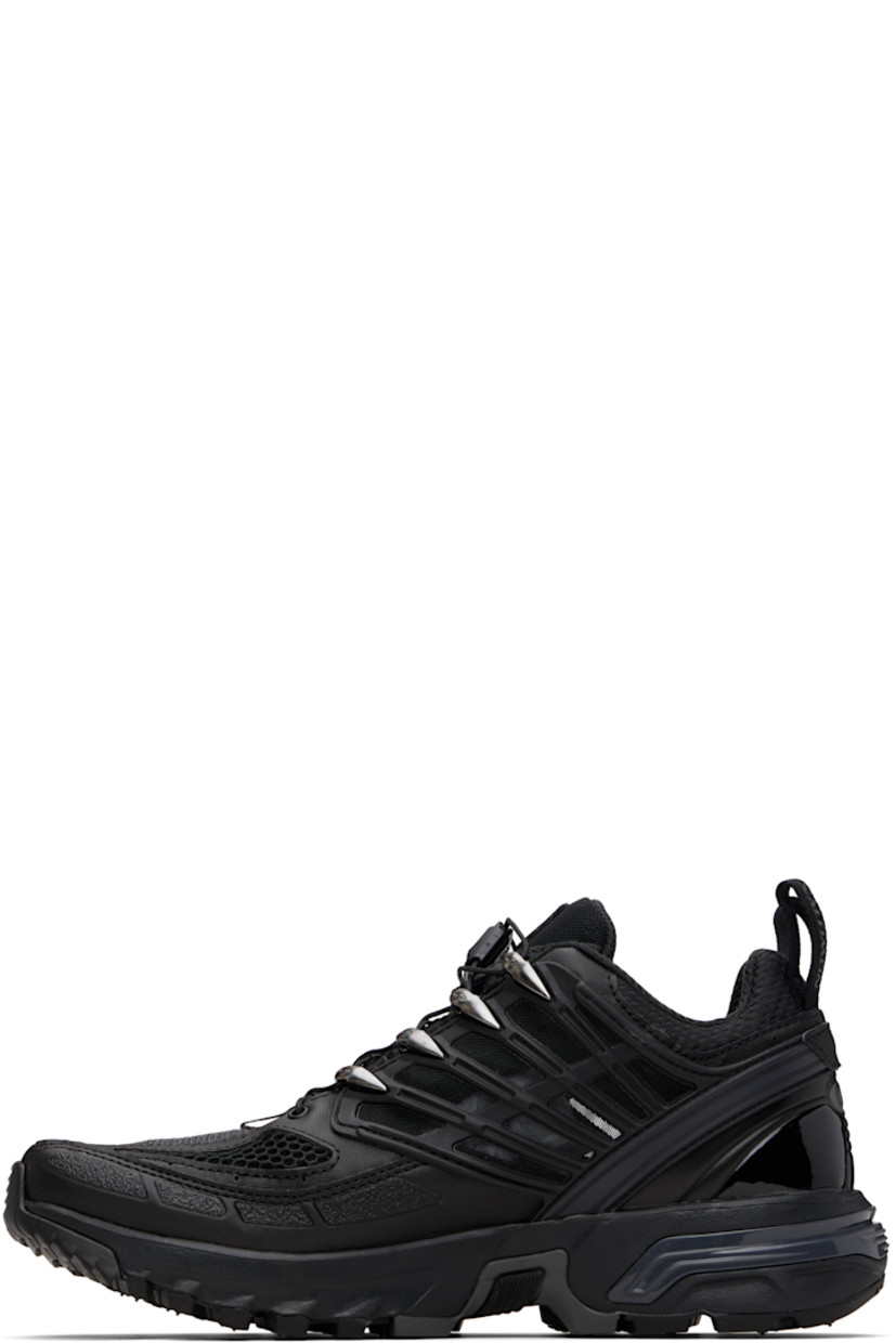 Low-top anti-debris 3D mesh and faux-leather sneakers.

· Logos bonded throughout
· Quicklace® closure
· Logo patch at vamp
· Velcro tab and logo patch at padded tongue
· Padded collar
· sensiFIT™ panel at sides
· Pull-loops at heel tab
· Logo embossed at heel counter
· Molded OrthoLite® footbed
· Mesh lining
· Agile Chassis™ System at foam rubber EnergyCell midsole
· Treaded All Terrain Contagrip® rubber sole

Supplier color: Black/Black/Black