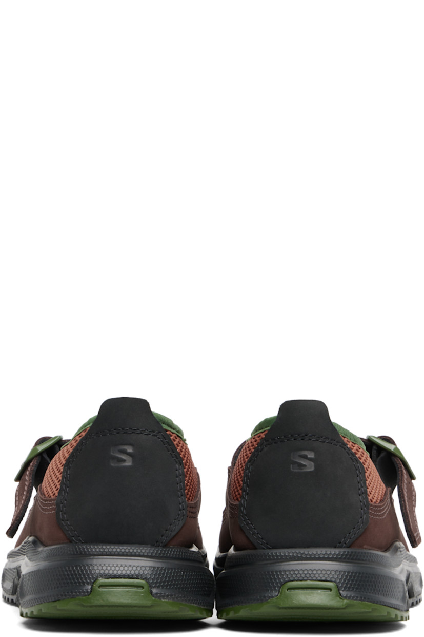 Mesh and nubuck Mary Jane-style low-top sneakers.

· Paneled construction
· Logo embossed at toe
· Pin-buckle strap at vamp
· Pull-tab at heel collar
· Logo embossed at heel tab
· Collapsible heel counter
· Faux-suede lining
· Molded rubber footbed
· Treaded Contagrip® rubber sole

Supplier color: Russet/Black/Roa