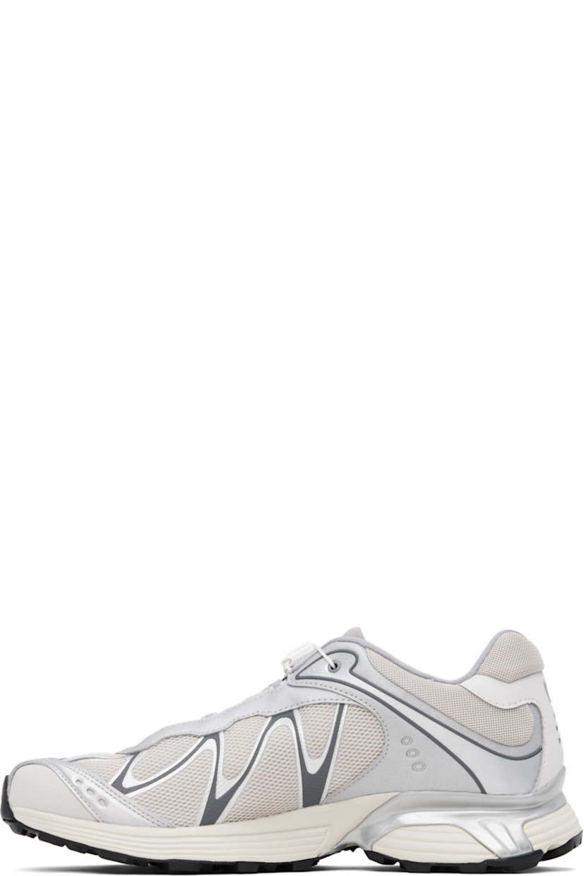 Low-top mesh and faux-leather sneakers in silver tone and beige.

· Reflective detailing throughout
· Logo embossed at toe
· Quicklace™ closure
· Logo patch at padded tongue
· Padded collar
· sensiFIT™ panel at sides
· Logo printed at outer side and heel tab
· Molded OrthoLite® insole
· Mesh lining
· Agile Chassis™ System at rubber EnergyCell midsole
· Treaded Mud Contagrip® rubber sole

Supplier color: Ftw silver/Lunar rock/Silver cloud