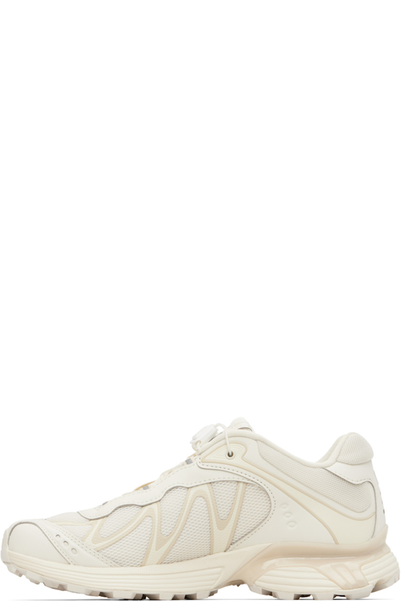 Low-top anti-debris 3D mesh and faux-leather sneakers.

· Reflective trim throughout
· Perforations and embossed logo at toe
· Quicklace™ closure
· Logo patch at padded tongue
· Padded collar
· Bonded sensiFIT™ panel at sides
· Logo printed at outer side and heel tab
· Molded OrthoLite® footbed
· Mesh lining
· Agile Chassis��™ System at foam rubber EnergyCell midsole
· Treaded Mud Contagrip® rubber sole

Supplier color: Vanilla ice/Almond milk/Vanilla ice