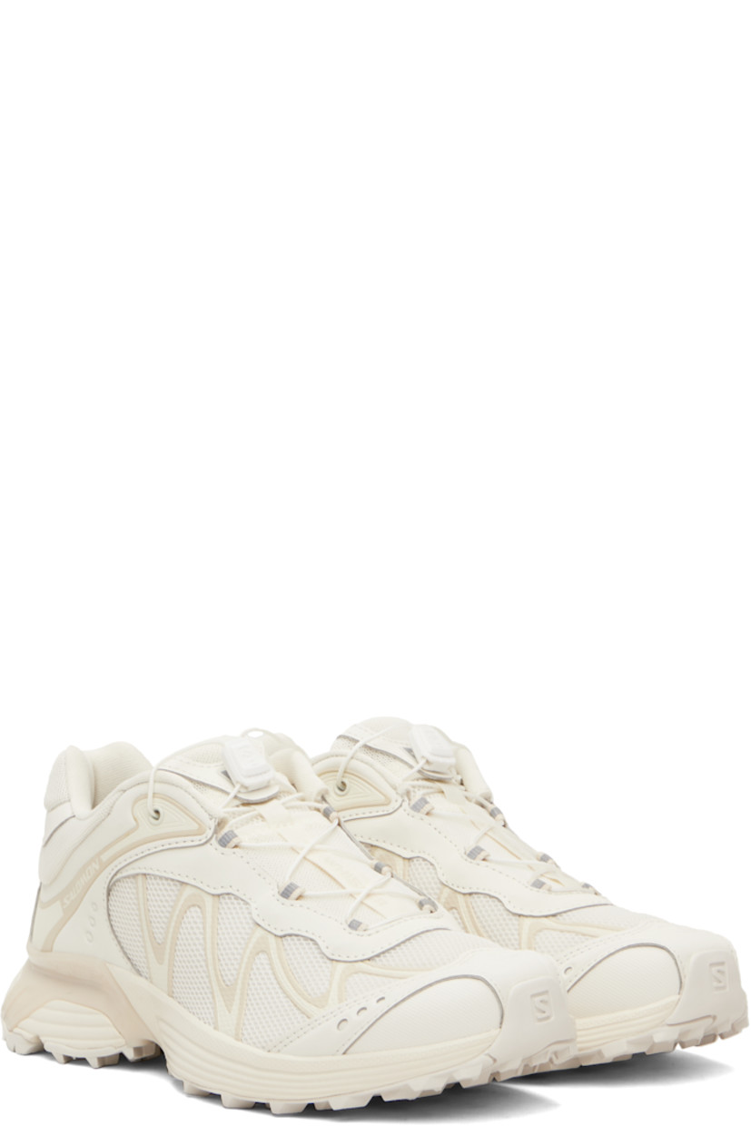 Low-top anti-debris 3D mesh and faux-leather sneakers.

· Reflective trim throughout
· Perforations and embossed logo at toe
· Quicklace™ closure
· Logo patch at padded tongue
· Padded collar
· Bonded sensiFIT™ panel at sides
· Logo printed at outer side and heel tab
· Molded OrthoLite® footbed
· Mesh lining
· Agile Chassis™ System at foam rubber EnergyCell midsole
· Treaded Mud Contagrip® rubber sole

Supplier color: Vanilla ice/Almond milk/Vanilla ice