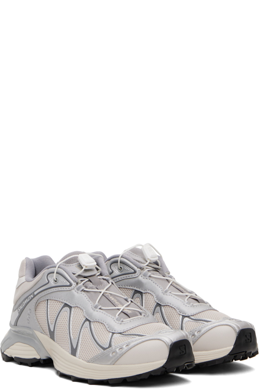 Low-top anti-debris 3D mesh and faux-leather sneakers.

· Reflective trim throughout
· Perforations and embossed logo at toe
· Quicklace™ closure
· Logo patch at padded tongue
· Padded collar
· Bonded sensiFIT™ panel at sides
· Logo printed at outer side and heel tab
· Molded OrthoLite® footbed
· Mesh lining
· Agile Chassis™ System at foam rubber EnergyCell midsole
· Treaded Mud Contagrip® rubber sole

Supplier color: Ftw silver/Lunar rock/Silver cloud