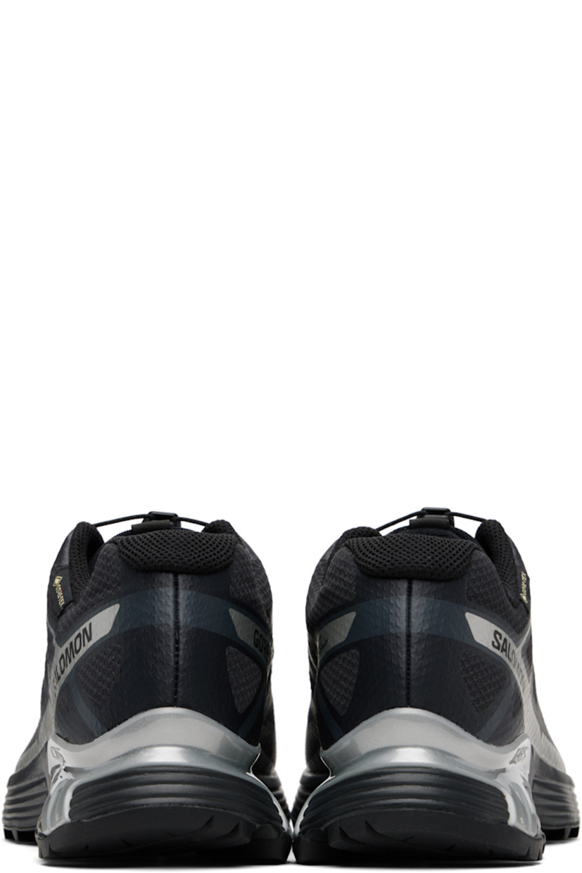 Low-top mesh sneakers.

· Waterproof GORE-TEX™ membrane
· Bonded trim throughout
· Quicklace™ closure
· Logo patch at vamp
· Logo-woven pull-loop at tongue
· Padded tongue and collar
· Logo printed at outer side
· Bonded SensiFit™ panel at sides
· Molded OrthoLite® insole
· Mesh lining
· Agile Chassis™ Skeleton at EnergyCell midsole
· Treaded Mud Contagrip® rubber sole

Supplier color: Black/Black/Ftw silver
