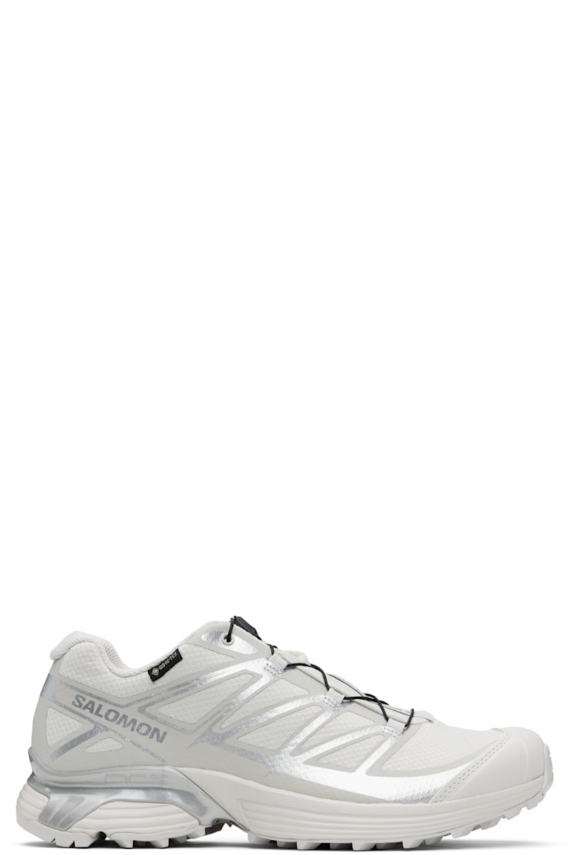 Low-top mesh sneakers.

· Waterproof GORE-TEX™ membrane
· Bonded trim throughout
· Quicklace™ closure
· Logo patch at vamp
· Logo-woven pull-loop at tongue
· Padded tongue and collar
· Logo printed at outer side
· Bonded SensiFit™ panel at sides
· Molded OrthoLite® insole
· Mesh lining
· Agile Chassis™ Skeleton at EnergyCell midsole
· Treaded Mud Contagrip® rubber sole

Supplier color: Lunar rock/Alloy/Ftw silver