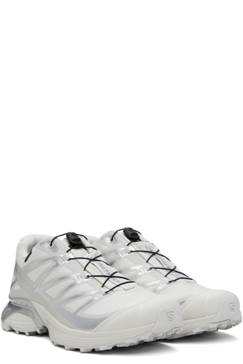 Low-top mesh sneakers.

· Waterproof GORE-TEX™ membrane
· Bonded trim throughout
· Quicklace™ closure
· Logo patch at vamp
· Logo-woven pull-loop at tongue
· Padded tongue and collar
· Logo printed at outer side
· Bonded SensiFit™ panel at sides
· Molded OrthoLite® insole
· Mesh lining
· Agile Chassis™ Skeleton at EnergyCell midsole
· Treaded Mud Contagrip® rubber sole

Supplier color: Lunar rock/Alloy/Ftw silver