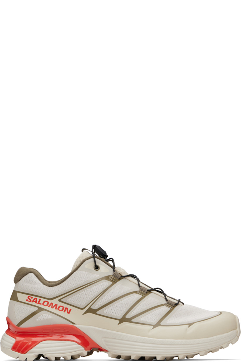 Low-top anti-debris mesh and buffed faux-leather sneakers.

· Bonded trim throughout
· Logo-embossed rubber cap toe
· Quicklace™ closure
· Logo-woven pull-loop at padded tongue
· Padded collar
· Bonded sensiFIT™ panel at sides
· Text printed at inner side
· Logo printed at outer side
· Molded OrthoLite® footbed
· Mesh lining
· Agile Chassis™ System at rubber EnergyCell midsole
· Treaded Mud Contagrip® rubber sole

Supplier color: Rainy day/Stone gray/Cherry tomato