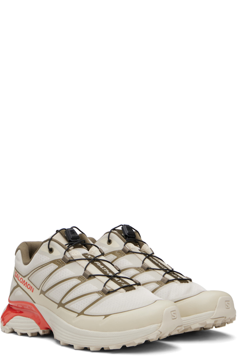 Low-top anti-debris mesh and buffed faux-leather sneakers.

· Bonded trim throughout
· Logo-embossed rubber cap toe
· Quicklace™ closure
· Logo-woven pull-loop at padded tongue
· Padded collar
· Bonded sensiFIT™ panel at sides
· Text printed at inner side
· Logo printed at outer side
· Molded OrthoLite® footbed
· Mesh lining
· Agile Chassis™ System at rubber EnergyCell midsole
· Treaded Mud Contagrip® rubber sole

Supplier color: Rainy day/Stone gray/Cherry tomato