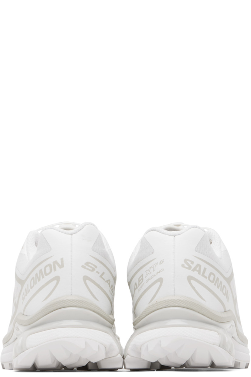 Low-top mesh sneakers.

· Bonded trim throughout
· Quicklace® closure
· Logo patch at vamp
· Logo-woven pull-loop at padded tongue
· Padded collar
· Bonded sensiFIT™ panel at sides
· Text printed at inner side
· Logo printed at outer side
· Molded OrthoLite® footbed
· EndoFit™ mesh lining
· Agile Chassis™ System at foam rubber EnergyCell midsole
· Treaded Mud Contagrip® rubber sole

Supplier color: White/White/Lunar rock
