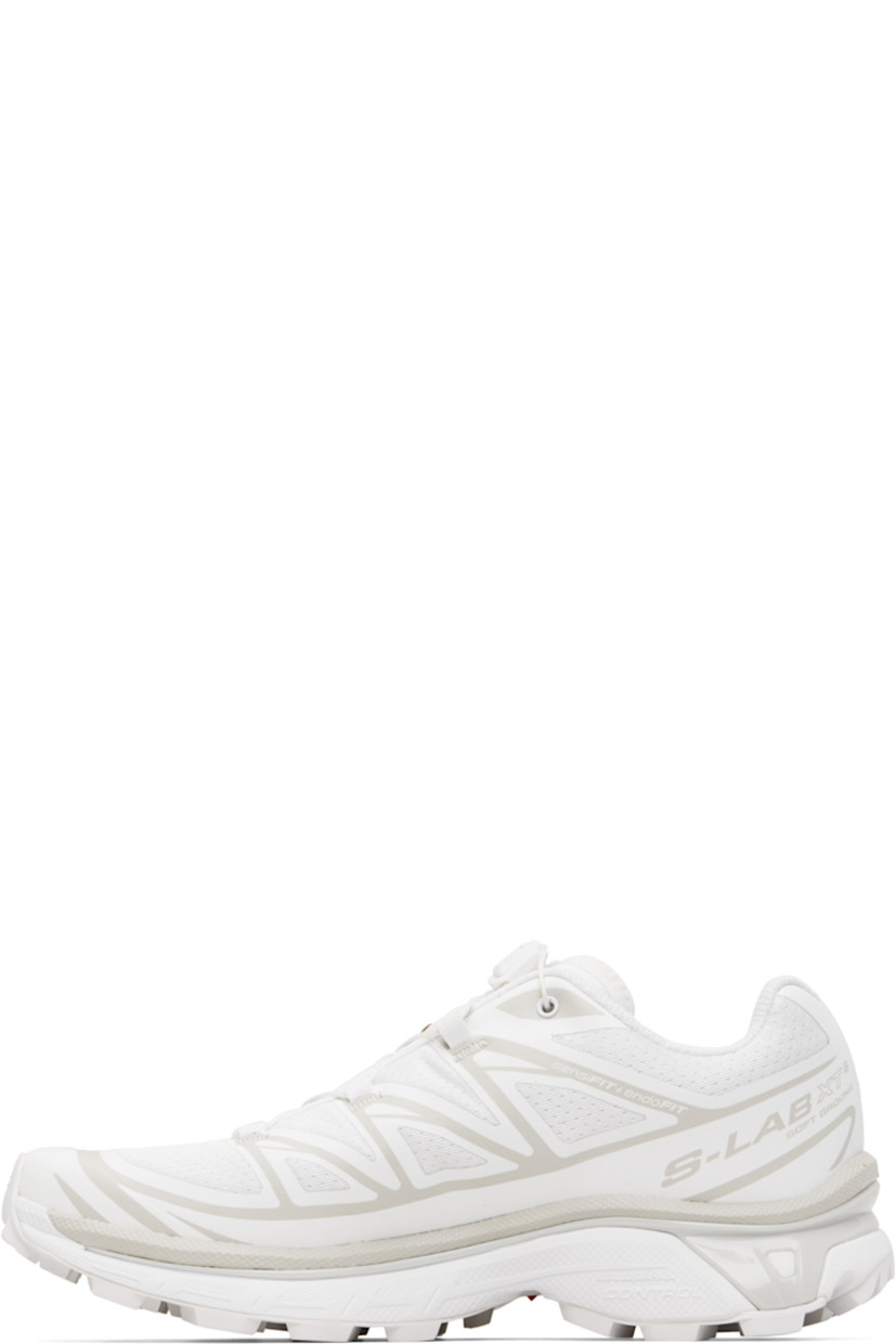 Low-top mesh sneakers.

· Bonded trim throughout
· Quicklace® closure
· Logo patch at vamp
· Logo-woven pull-loop at padded tongue
· Padded collar
· Bonded sensiFIT™ panel at sides
· Text printed at inner side
· Logo printed at outer side
· Molded OrthoLite® footbed
· EndoFit™ mesh lining
· Agile Chassis™ System at foam rubber EnergyCell midsole
· Treaded Mud Contagrip® rubber sole

Supplier color: White/White/Lunar rock