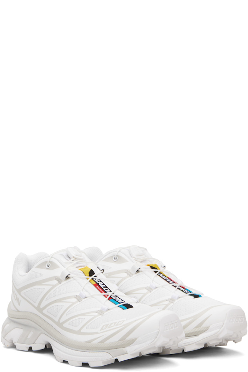 Low-top mesh sneakers.

· Bonded trim throughout
· Quicklace® closure
· Logo patch at vamp
· Logo-woven pull-loop at padded tongue
· Padded collar
· Bonded sensiFIT™ panel at sides
· Text printed at inner side
· Logo printed at outer side
· Molded OrthoLite® footbed
· EndoFit™ mesh lining
· Agile Chassis™ System at foam rubber EnergyCell midsole
· Treaded Mud Contagrip® rubber sole

Supplier color: White/White/Lunar rock