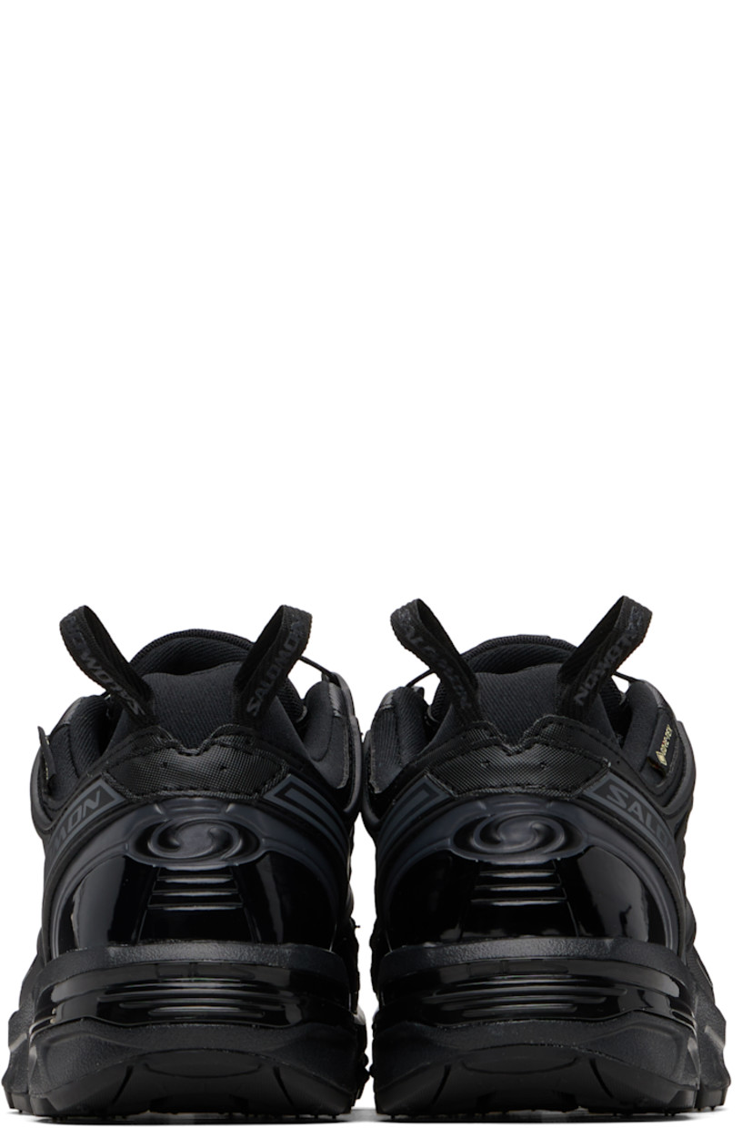 Low-top GORE-TEX™ faux-leather and anti-debris mesh sneakers.

· PFC-free waterproof
· Logos bonded throughout
· Quicklace® closure
· Logo patch at vamp
· Velcro tab and logo patch at padded tongue
· Padded collar
· sensiFIT™ panel at sides
· Logo flag at outer side
· Pull-loops at heel tab
· Logo embossed at heel counter
· Molded OrthoLite® footbed
· Mesh lining
· Agile Chassis™ System at foam rubber EnergyCell midsole
· Treaded All Terrain Contagrip® rubber sole

Supplier color: Black/Black/Asphalt