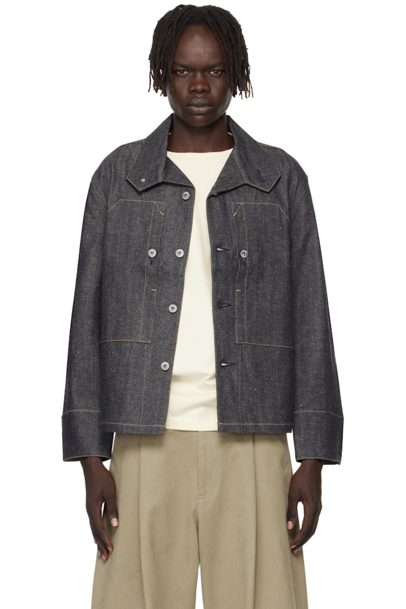 Non-stretch denim jacket.

· Modified spread collar
· Button closure
· Patch pockets at chest
· Adjustable button fastening at cuffs
· Contrast stitching in tan

Supplier color: Raw indigo