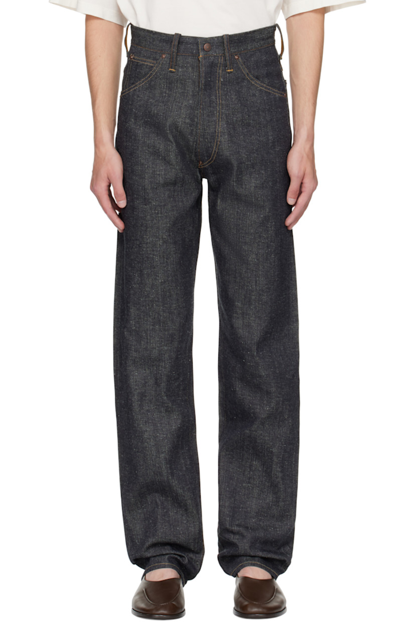 Non-stretch organic cotton sanforized denim jeans.

· Indigo- and sulfur-dyed
· Belt loops
· Five-pocket styling
· Zip fly
· Cinch strap at back waistband
· Mud-dyed leather patch at back waistband
· Contrast stitching in tan

Supplier color: Raw Indigo