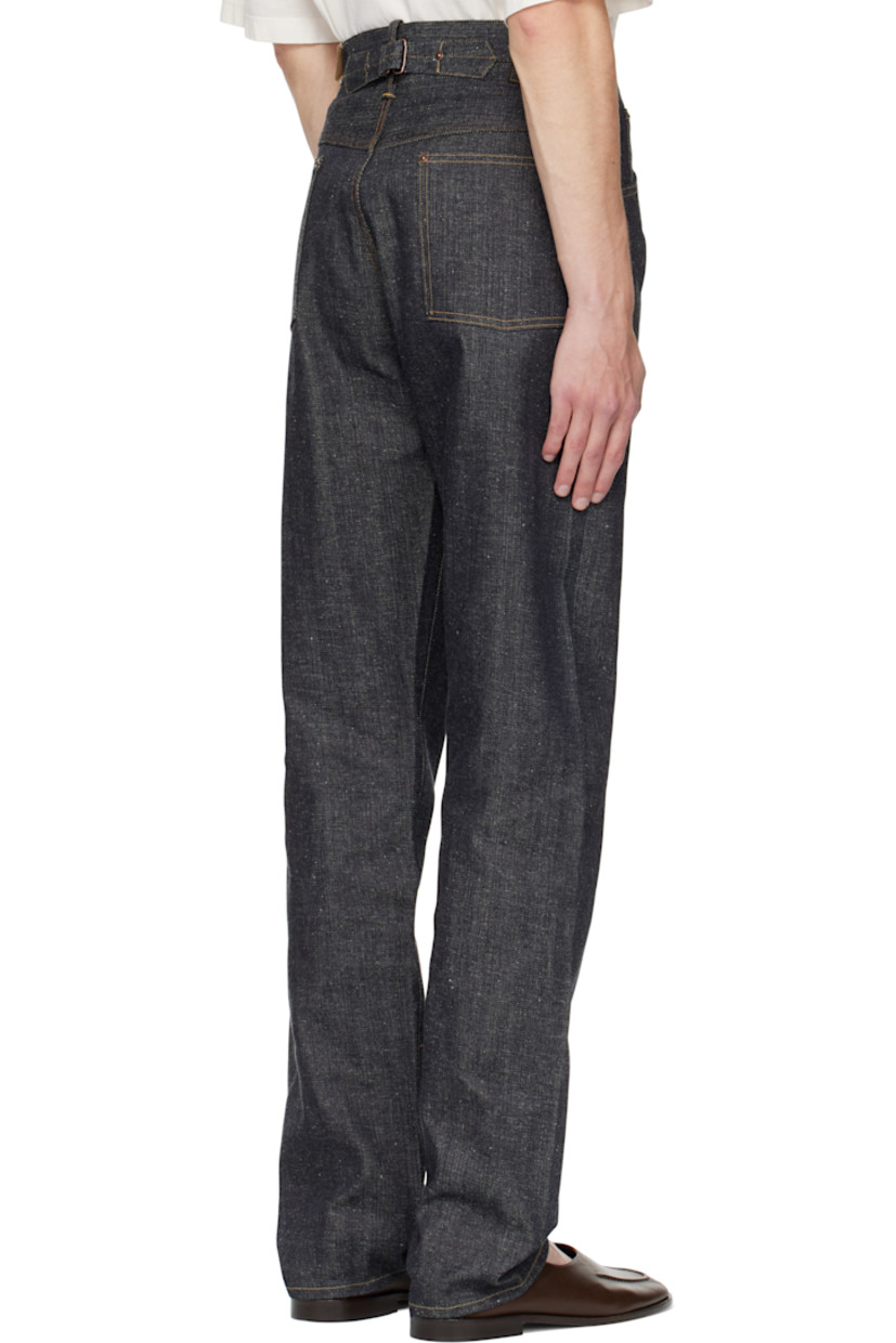 Non-stretch organic cotton sanforized denim jeans.

· Indigo- and sulfur-dyed
· Belt loops
· Five-pocket styling
· Zip fly
· Cinch strap at back waistband
· Mud-dyed leather patch at back waistband
· Contrast stitching in tan

Supplier color: Raw Indigo