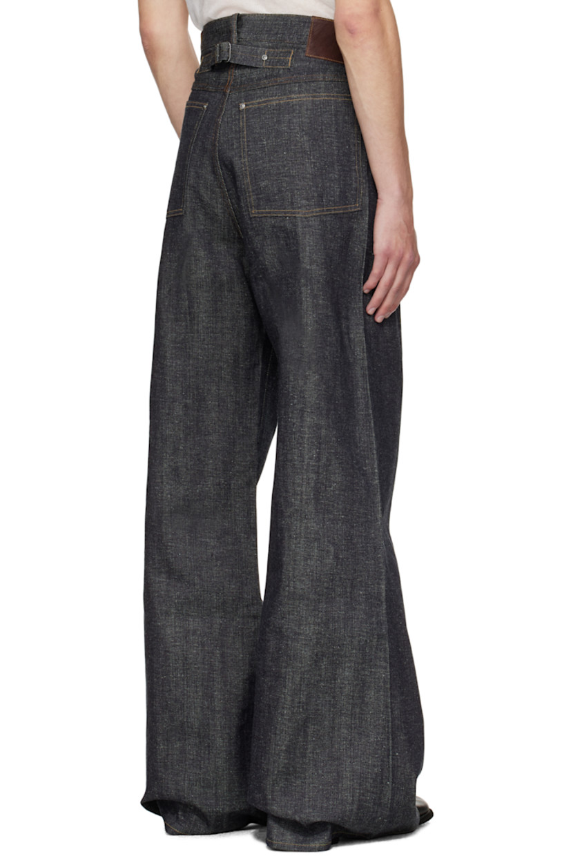 Rope-dyed non-stretch selvedge denim jeans.

· Indigo- and sulfur-based dye
· Flared, wide-leg
· Belt loops
· Five-pocket styling
· Zip fly
· Horse leather patch and jacron logo patch at back waistband
· Cinch strap at back
· Contrast stitching in tan

Supplier color: Raw indigo